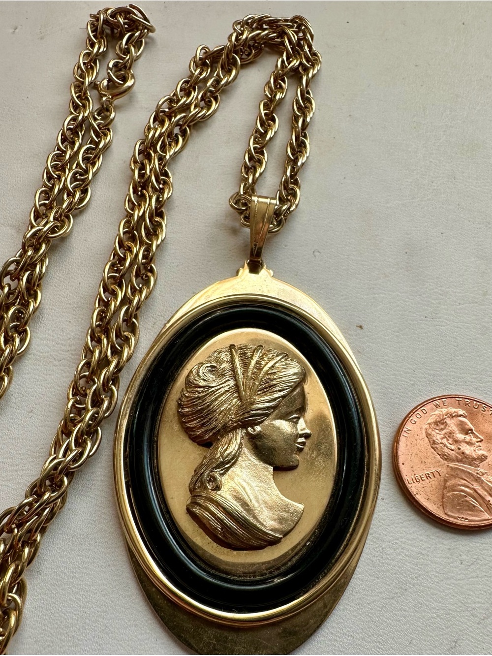 Vintage Avon Gold Cameo oval Pendant on a 24” rope Necklace - Gold and Black